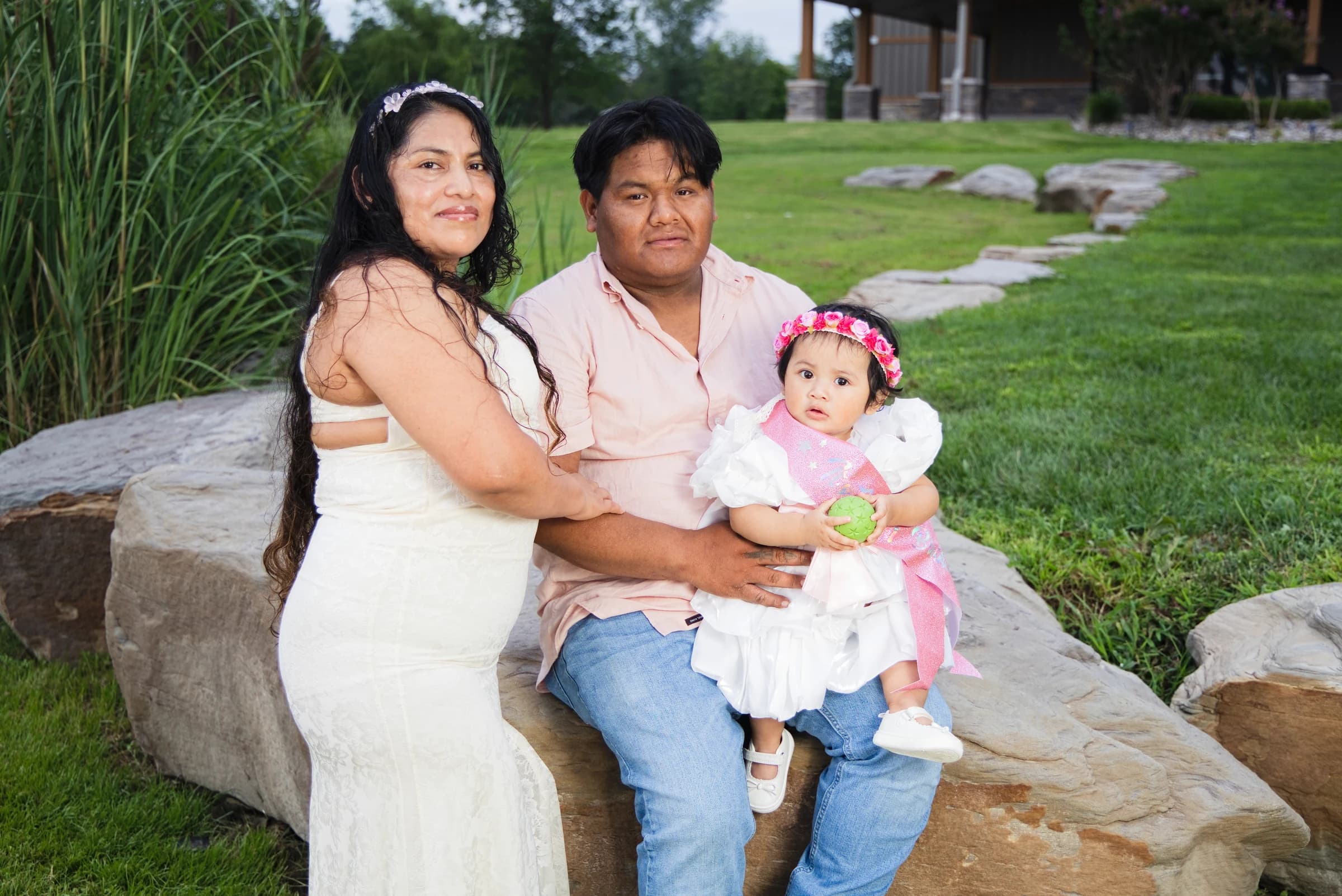 A family with their baby during an outdoor portrait session
