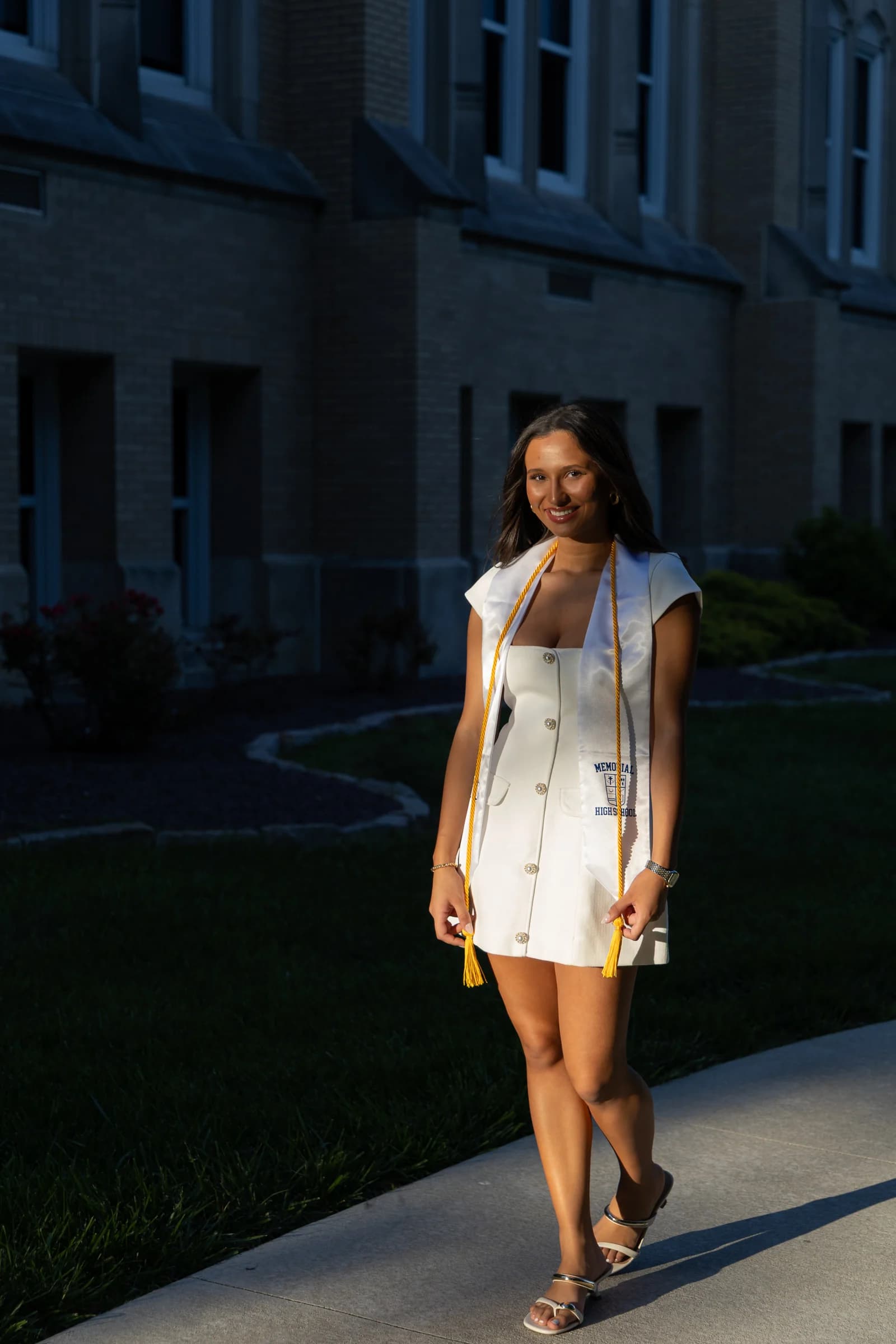 Full-length portrait in afternoon light and a white dress